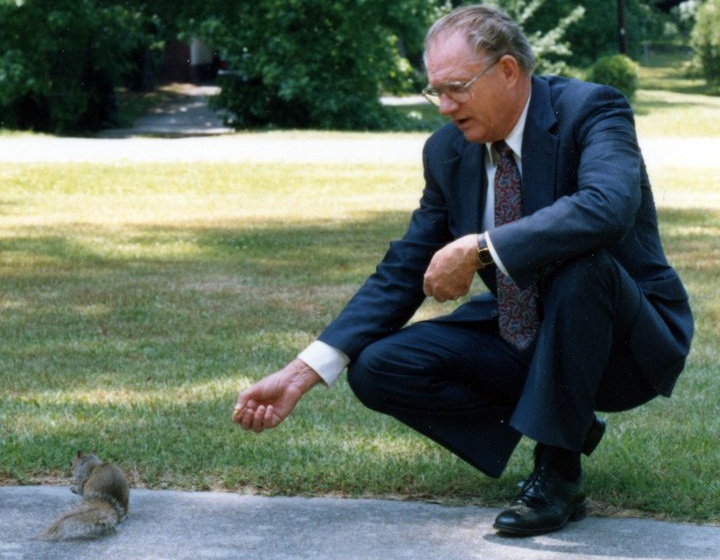 Carl Conner Feeding A Squirrel